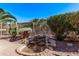 Inviting backyard water feature surrounded by lush greenery and a well-maintained garden at 4203 E Narrowleaf Dr, Gilbert, AZ 85298