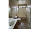 Clean bathroom features a tub-shower and tile floor at 43818 W Arizona Ave, Maricopa, AZ 85138