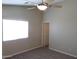 Neutral bedroom featuring plush carpeting and a ceiling fan at 43818 W Arizona Ave, Maricopa, AZ 85138