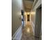 Hallway with tile floor and decorative wainscotting at 43818 W Arizona Ave, Maricopa, AZ 85138