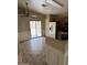 Bright kitchen area with tile floors and stainless steel appliances at 43818 W Arizona Ave, Maricopa, AZ 85138