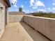 Private balcony with stucco walls offering neighborhood views at 45717 W Ranch Rd, Maricopa, AZ 85139