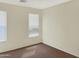 Bedroom featuring two large windows and neutral-colored walls at 45717 W Ranch Rd, Maricopa, AZ 85139