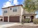 Two-story home featuring a three-car garage and neutral exterior at 45717 W Ranch Rd, Maricopa, AZ 85139