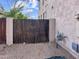 Side yard featuring a private gate, providing secure access to the property at 45717 W Ranch Rd, Maricopa, AZ 85139