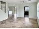 Open living room with tile floors, archways, and natural light at 45717 W Ranch Rd, Maricopa, AZ 85139