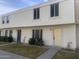 View of a two-story townhouse with a well-maintained exterior and walkway at 6410 S La Corta Dr, Tempe, AZ 85283