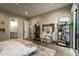 Bedroom with neutral walls, hardwood floors, a vanity, and an exterior view of a door to the exterior of the home at 6455 E Calle Del Media --, Scottsdale, AZ 85251