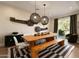 Bright dining room featuring a wooden table, bench, and stylish black and white striped rug at 6455 E Calle Del Media --, Scottsdale, AZ 85251