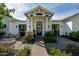 Inviting front entrance with modern architecture, a brick pathway, and beautiful landscaping at 6455 E Calle Del Media --, Scottsdale, AZ 85251