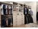 Well-organized walk-in closet with ample shelving, hanging space, drawers, and a cozy rug at 6455 E Calle Del Media --, Scottsdale, AZ 85251