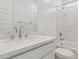 Well-lit bathroom with tiled shower, white sink, and marble countertops at 7436 W Buckhorn Trl, Peoria, AZ 85383