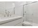 Bright, modern bathroom with a glass-enclosed shower, white cabinets, and sleek fixtures at 7436 W Buckhorn Trl, Peoria, AZ 85383