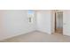 Bright bedroom features neutral carpet, natural light from the window and a closet for storage at 7436 W Buckhorn Trl, Peoria, AZ 85383