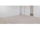 Bright bedroom with carpet floors, and a door to the Primary bathroom at 7436 W Buckhorn Trl, Peoria, AZ 85383