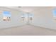Bright bedroom with three windows and carpet floors at 7436 W Buckhorn Trl, Peoria, AZ 85383