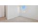 Bedroom with carpeted floors, ample closet space, and a window at 7436 W Buckhorn Trl, Peoria, AZ 85383