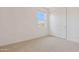 This bedroom has a window with mountain views and a closet for storage at 7436 W Buckhorn Trl, Peoria, AZ 85383