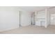 Bright bedroom with white walls, carpeted flooring, and a small study nook at 7436 W Buckhorn Trl, Peoria, AZ 85383