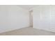 Bright bedroom with white closet doors, neutral carpet, and ample natural light at 7436 W Buckhorn Trl, Peoria, AZ 85383