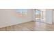 Bright bedroom with sliding glass door, tile floors, and neutral paint at 7436 W Buckhorn Trl, Peoria, AZ 85383