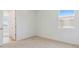 This bedroom has neutral carpet, a window, and a closet with ample storage space at 7436 W Buckhorn Trl, Peoria, AZ 85383