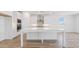 Bright kitchen with large island, stainless vent hood, and built in microwave and oven at 7436 W Buckhorn Trl, Peoria, AZ 85383