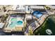 Aerial view of community pool, with tennis courts, surrounding the golf course, and a pond with fountain at 755 S Arrowwood Way, Mesa, AZ 85208