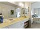 Bathroom featuring a large mirror, vanity, and a glimpse into the bedroom at 755 S Arrowwood Way, Mesa, AZ 85208