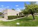 Charming single-story home with lush green lawn and mature trees, offering a serene outdoor space at 755 S Arrowwood Way, Mesa, AZ 85208