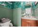 Stylish half bath featuring green wallpaper, and updated fixtures at 927 E Baylor Ln, Gilbert, AZ 85296