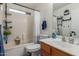 Cozy bathroom featuring modern fixtures and a shower-tub combination, maximizing space efficiency at 927 E Baylor Ln, Gilbert, AZ 85296