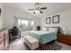 Relaxing primary bedroom with vaulted ceilings, a ceiling fan, and a view to the back yard at 927 E Baylor Ln, Gilbert, AZ 85296