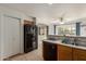 Kitchen has laminate countertops, a pantry and an opening to the dining and living areas at 927 E Baylor Ln, Gilbert, AZ 85296