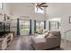 Bright living room featuring high ceilings, comfortable sofa, and a view of the backyard at 927 E Baylor Ln, Gilbert, AZ 85296