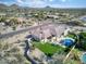 Expansive aerial view showcasing the backyard pool, putting green, and outdoor living space at 9826 N 131St St, Scottsdale, AZ 85259