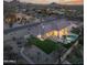 Expansive single-Gathering home featuring a large backyard with a pool, putting green, and mountain views at 9826 N 131St St, Scottsdale, AZ 85259