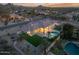 Aerial view showcasing the backyard pool, landscaped turf, and outdoor living space at 9826 N 131St St, Scottsdale, AZ 85259