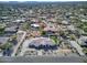 Gorgeous aerial view of a luxury home, manicured grounds, and neighborhood featuring mature landscaping at 9826 N 131St St, Scottsdale, AZ 85259