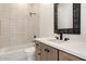 Bathroom with a modern vanity, white countertop, and tiled shower/tub combo at 9826 N 131St St, Scottsdale, AZ 85259