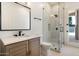 Modern bathroom features a glass enclosed shower and quartz countertop at 9826 N 131St St, Scottsdale, AZ 85259