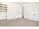 Minimal bedroom with built in shelves, white walls and neutral carpet at 9826 N 131St St, Scottsdale, AZ 85259