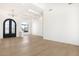 Entryway with hardwood floors, high ceilings, an archway with black double doors, and modern chandelier at 9826 N 131St St, Scottsdale, AZ 85259