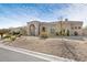 Single-story home featuring arched windows and desert landscaping at 9826 N 131St St, Scottsdale, AZ 85259