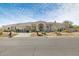 Charming single-story home with desert landscaping, circular driveway, and arched windows at 9826 N 131St St, Scottsdale, AZ 85259