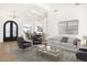 Open-concept living room features a decorative ceiling, stylish furnishings, and an adjacent dining area at 9826 N 131St St, Scottsdale, AZ 85259