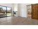 Bedroom with fireplace, ensuite bathroom and view of the outdoor patio at 9826 N 131St St, Scottsdale, AZ 85259