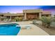 Resort-style backyard with a pool, diving board, and mature desert landscaping at 10325 E Celestial Dr, Scottsdale, AZ 85262