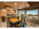 Dining room with decorative chairs and backyard views at 10325 E Celestial Dr, Scottsdale, AZ 85262