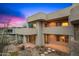 Exterior view of the home showcasing its unique architectural design and private balcony at 10325 E Celestial Dr, Scottsdale, AZ 85262